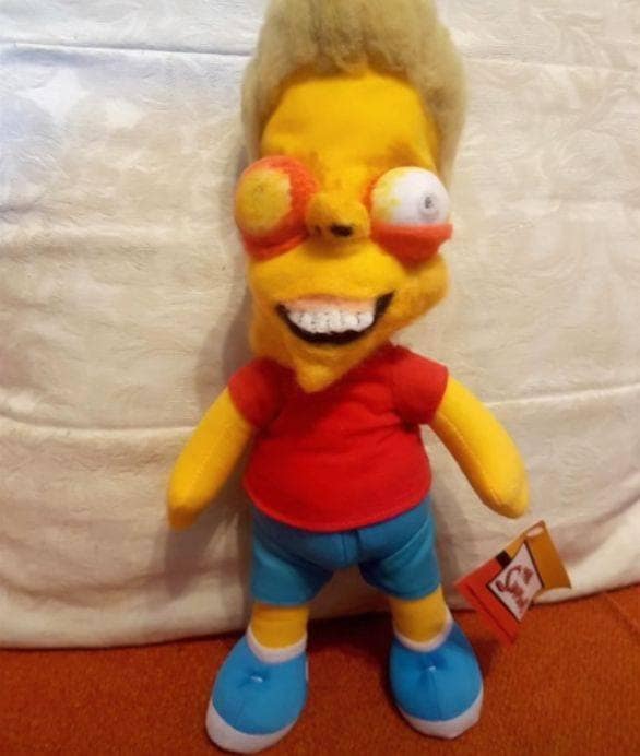 Horrifying Bart Simpson plush toy with bulging bloodshot eyes and weird teeth. Truly cursed funny knock offs of cartoons.