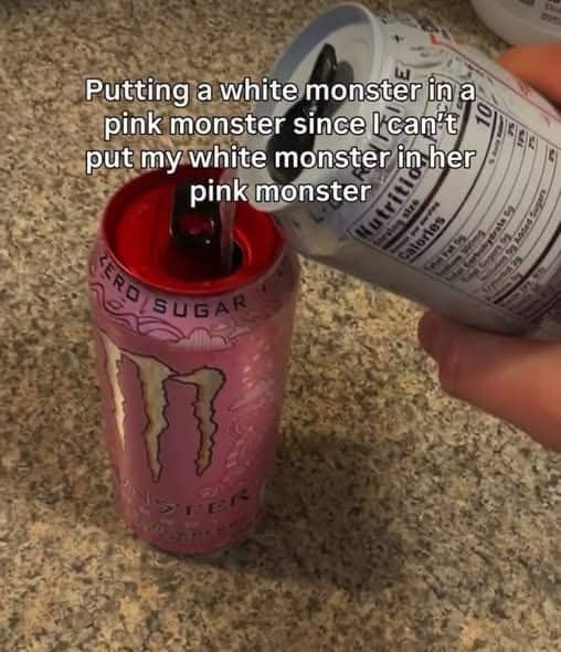 Person pouring white Monster Energy into a pink Monster can with a suggestive, humorous caption.