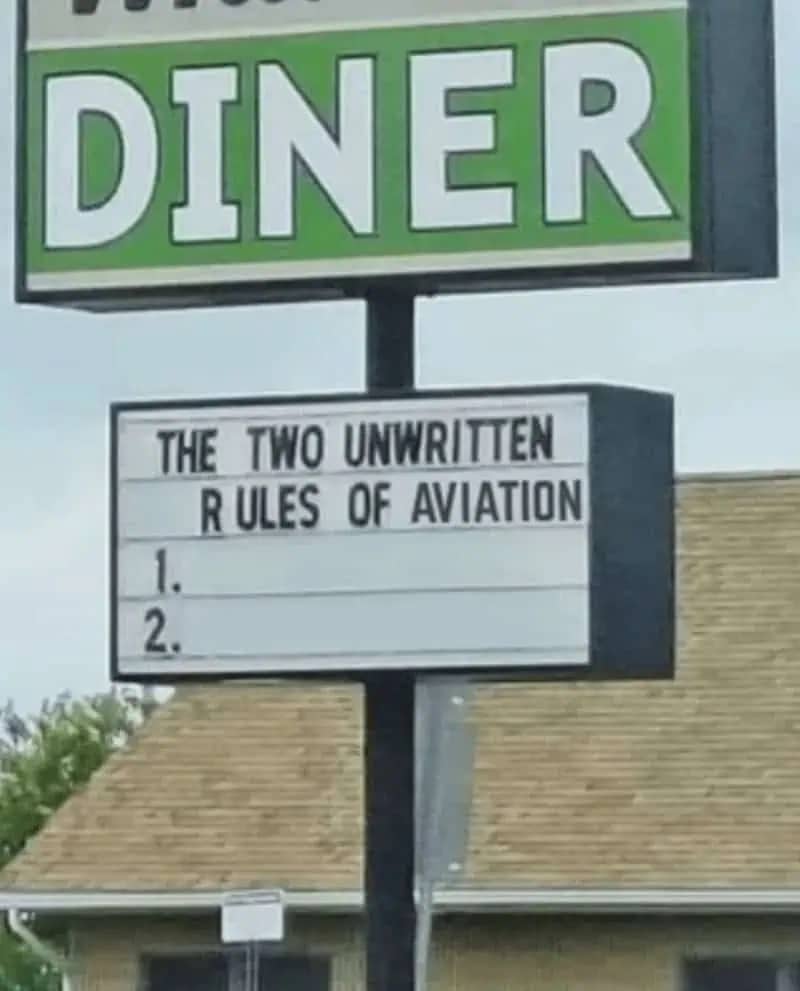 Funny diner marquee sign jokingly listing the two unwritten rules of aviation as blank lines.