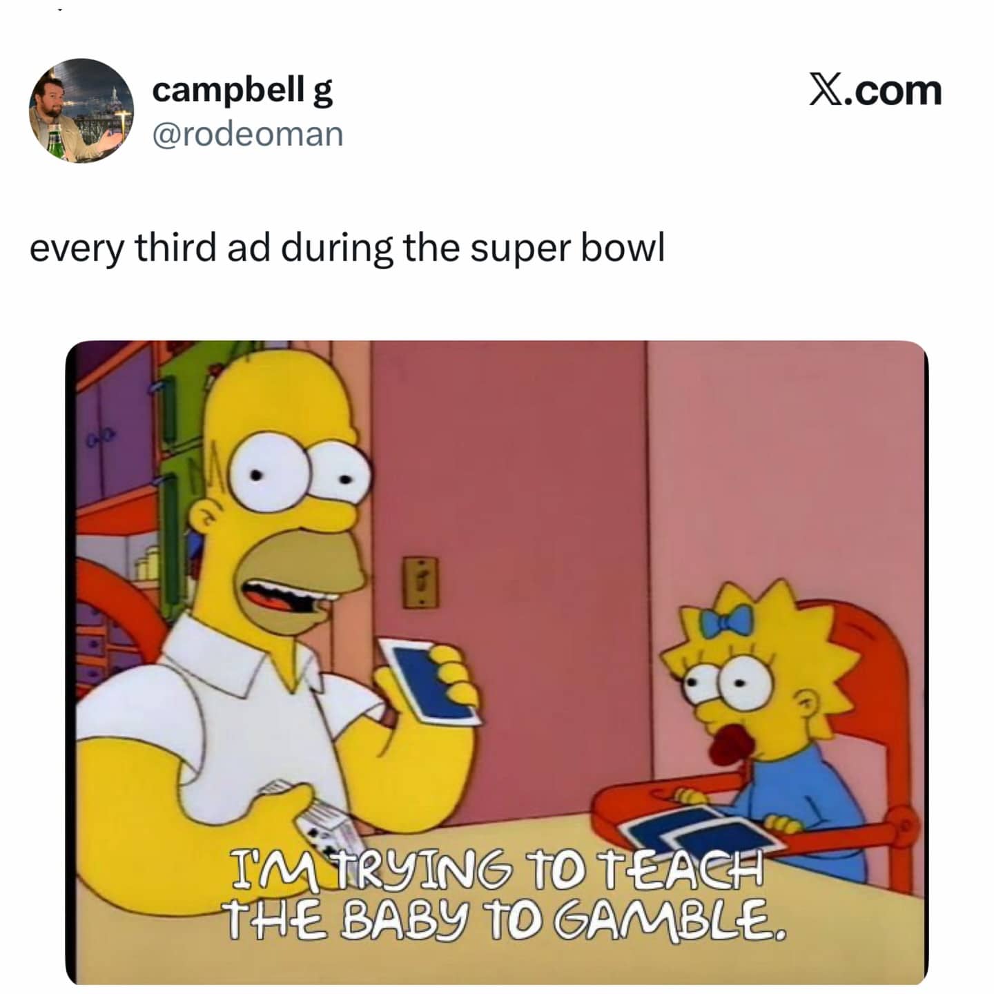 Homer Simpson holding a smartphone and teaching baby Maggie Simpson how to gamble at the table.