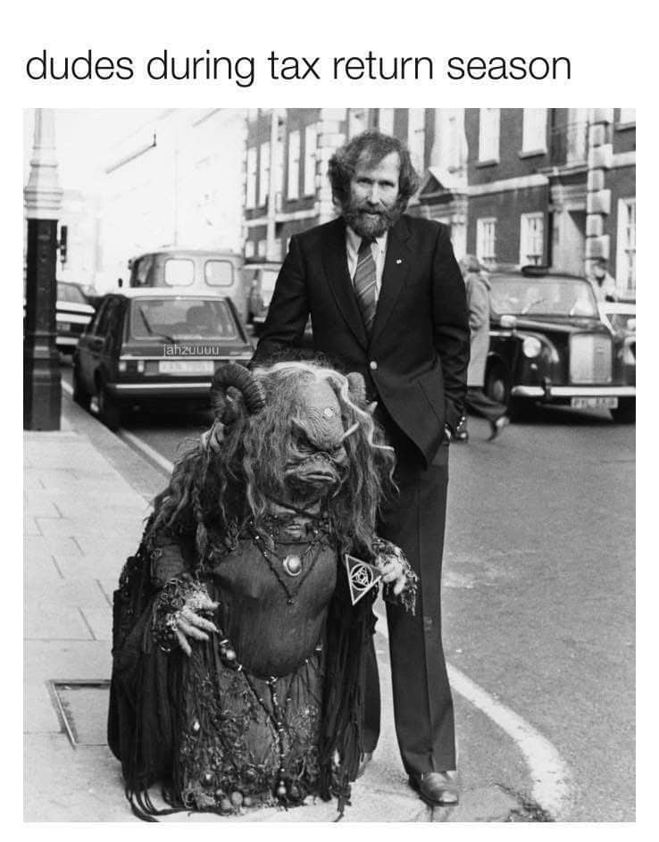 Vintage black and white photo of Jim Henson with a puppet, captioned dudes during tax return season.