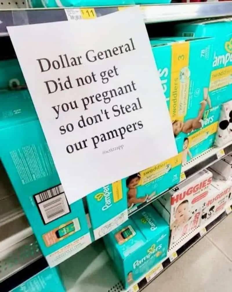 Aggressive Dollar General store sign telling customers not to steal pampers because they didn't get you pregnant.