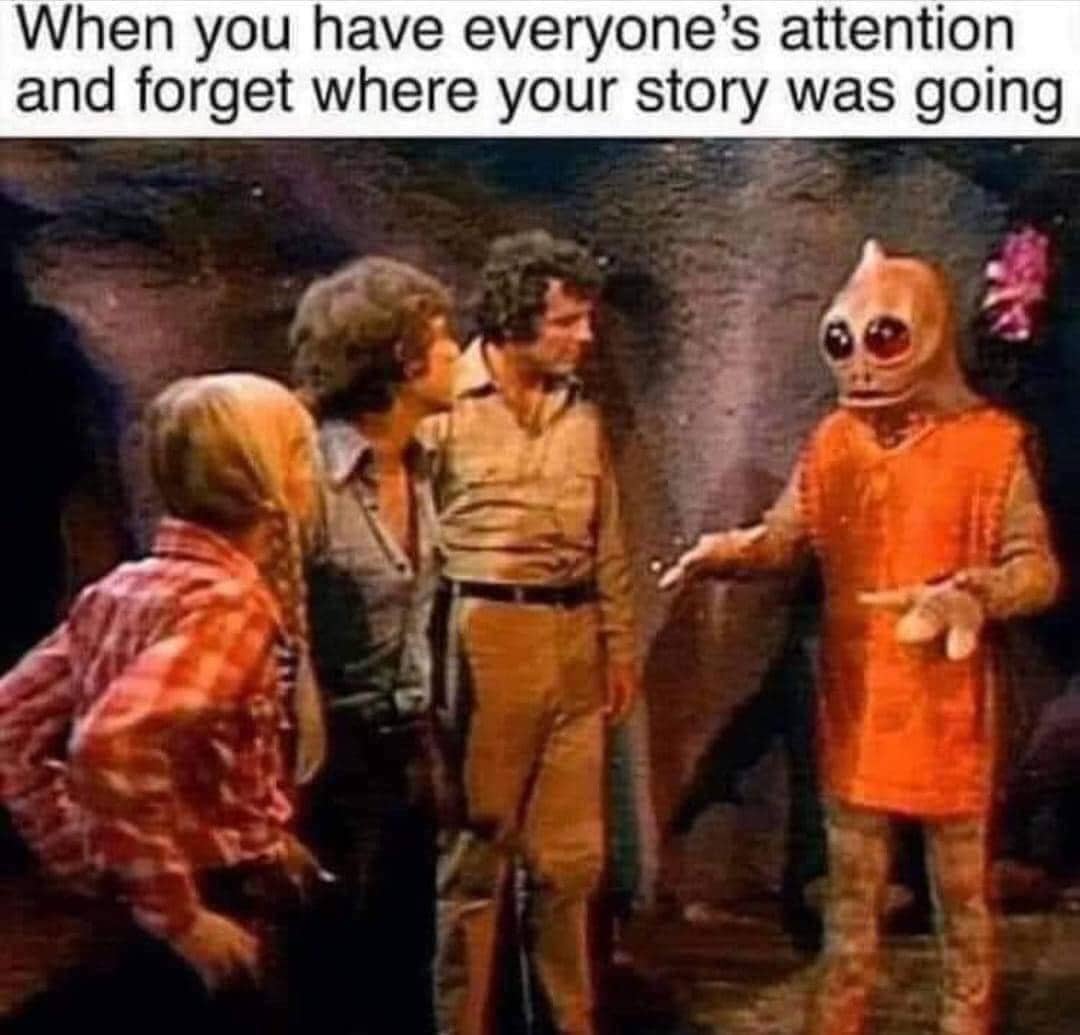 A bathroom sink with handles and a faucet that looks like a wide-eyed human face.