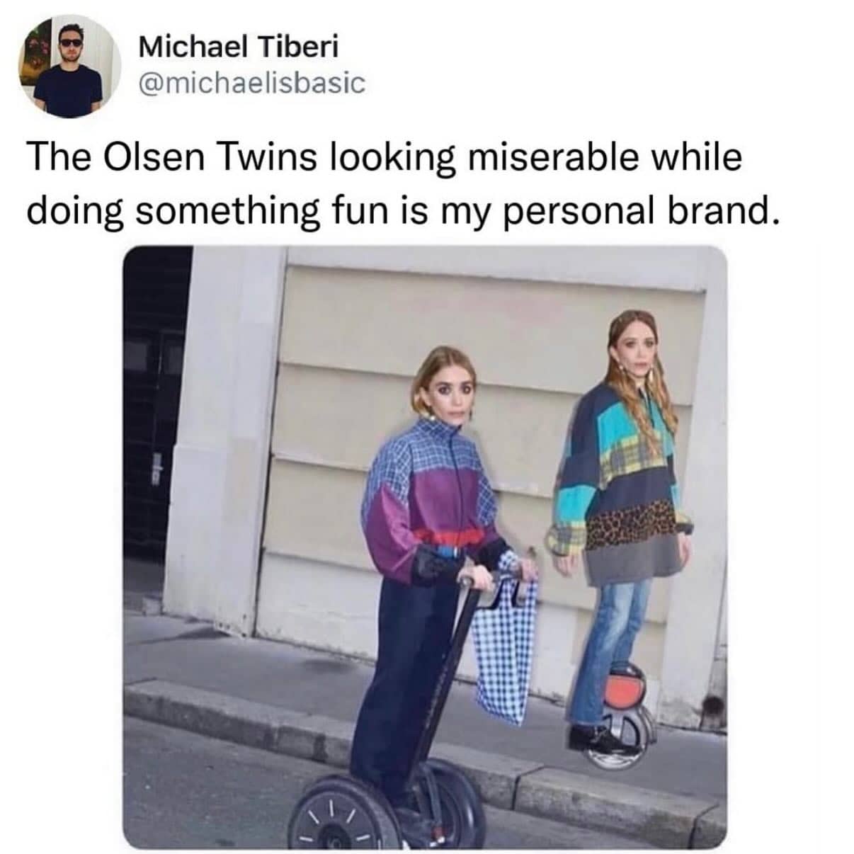 The Olsen twins looking somber while riding Segways and unicycles on a city street.