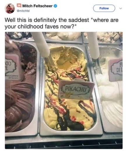 Yellow Pikachu gelato with chocolate and red swirls in a display case at an ice cream shop.