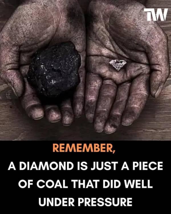 Close-up of dirty hands holding a large piece of coal and a small polished diamond with an inspirational quote.