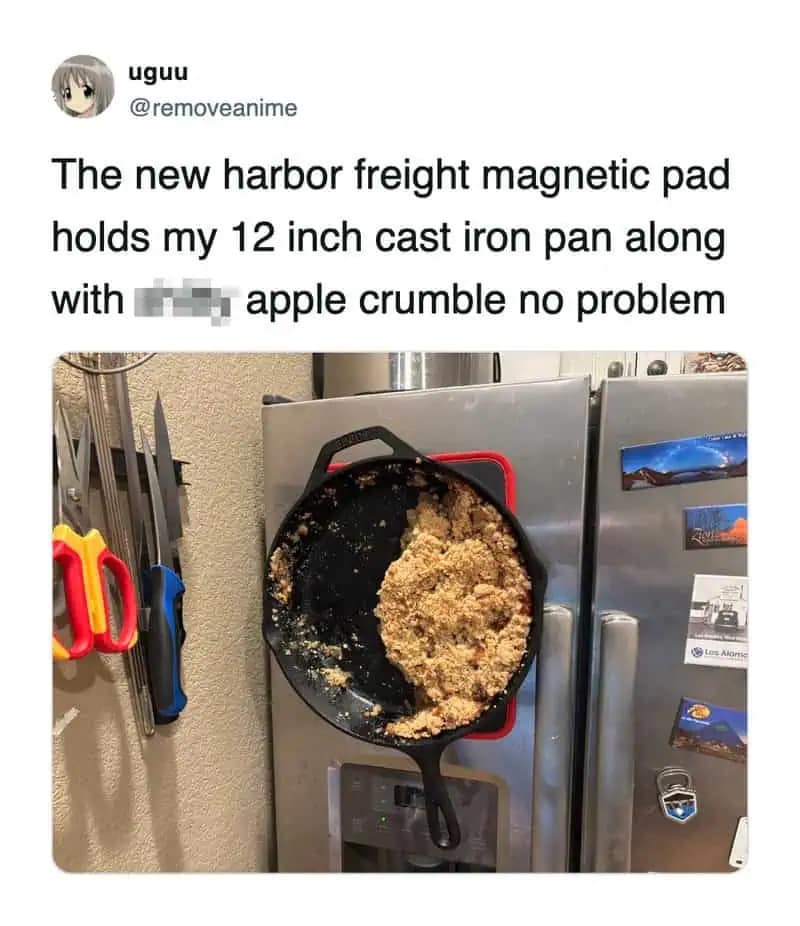 A meme dump photo of a cast iron skillet full of apple crumble sticking vertically to a refrigerator door thanks to a strong magnet.
