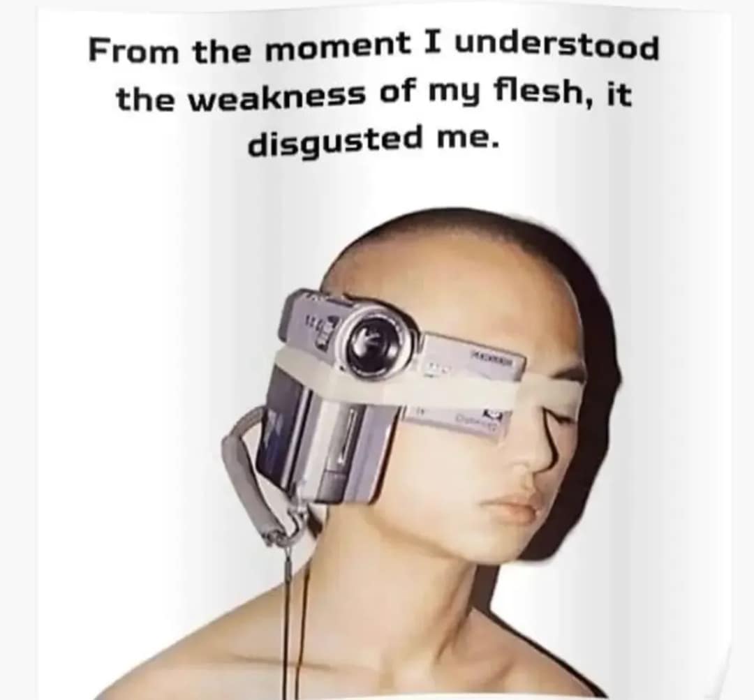 A surreal tech-priest funny meme showing a person with a retro silver camcorder physically strapped to their face with white tape, perfectly paired with the dramatic sci-fi meme dump quote, "From the moment I understood the weakness of my flesh, it disgusted me".