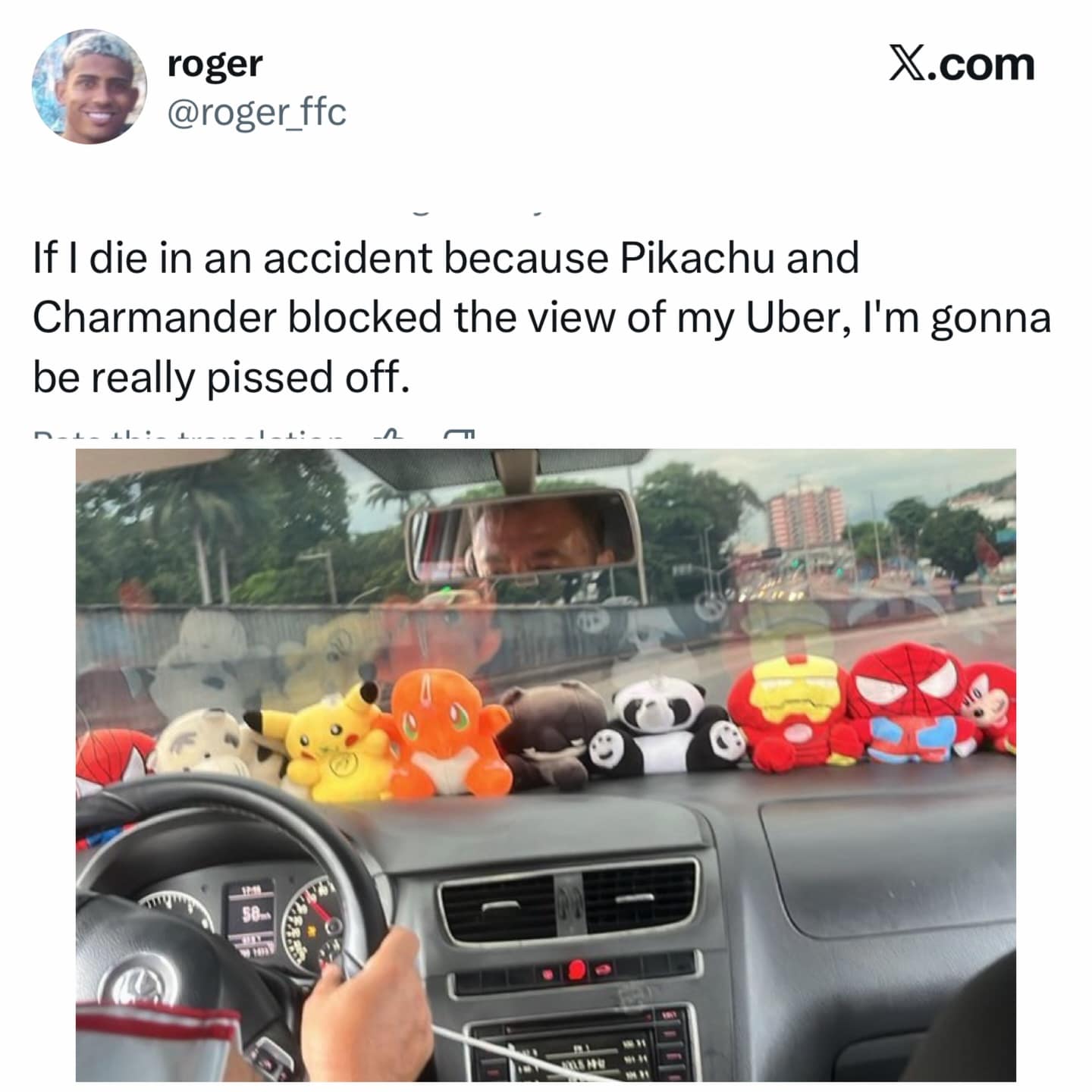 Uber driver dashboard dangerously covered in Pikachu and Charmander plushies. Relatable joke about risky rideshare trips.