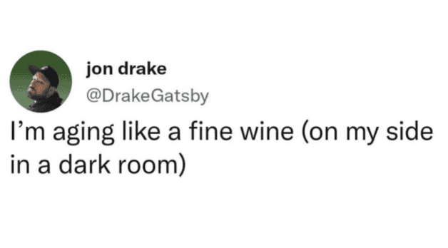 Tweet joking about aging like fine wine by lying on your side in a dark room. Relatable urge to isolate and stay in bed.