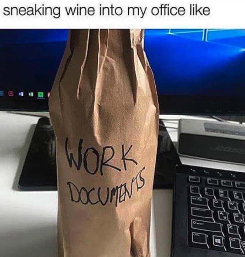 Wine bottle disguised as work documents in a paper bag millennial meme about office life.
