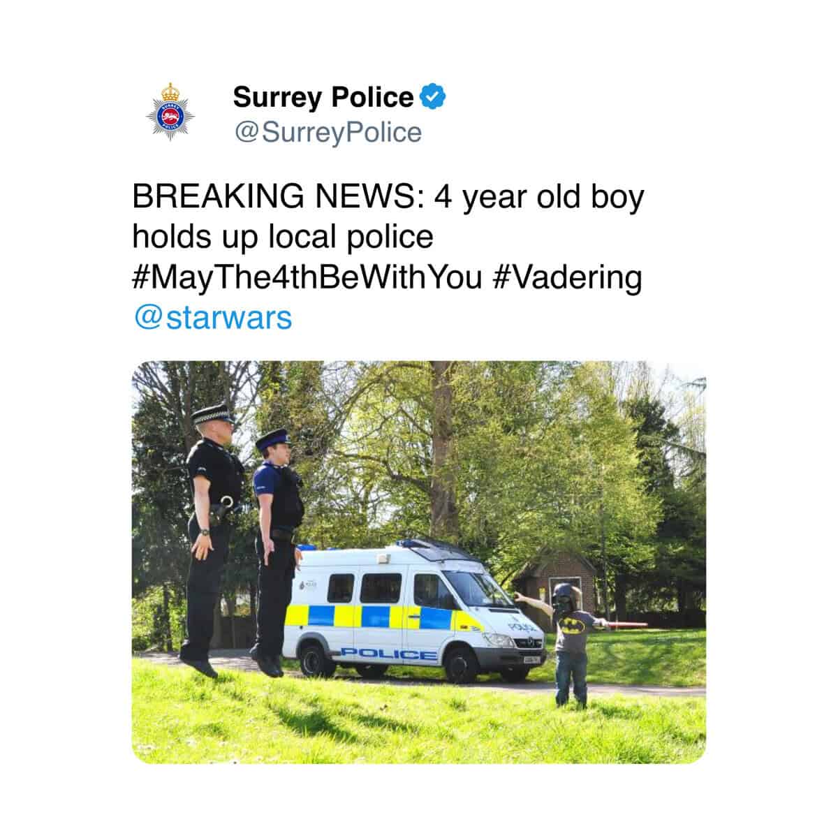 Surrey Police officers being levitated by a young boy dressed as Darth Vader for Star Wars day.