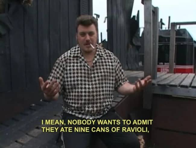 Ricky wearing a houndstooth shirt admitting nobody wants to admit eating nine cans of ravioli.