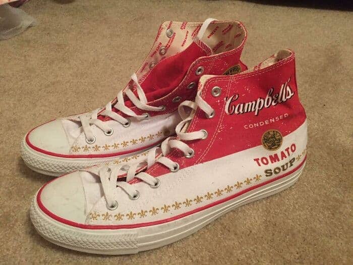 High-top canvas sneakers designed to look exactly like a classic red and white Campbell's Tomato Soup can.