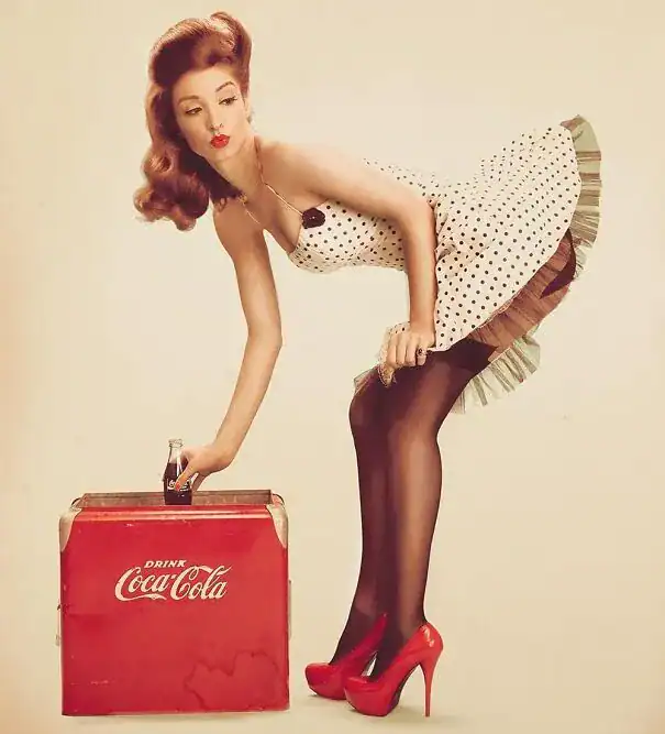 A flirtatious vintage ad for Coca-Cola featuring a pin-up style woman in a polka dot dress bending over a cooler.