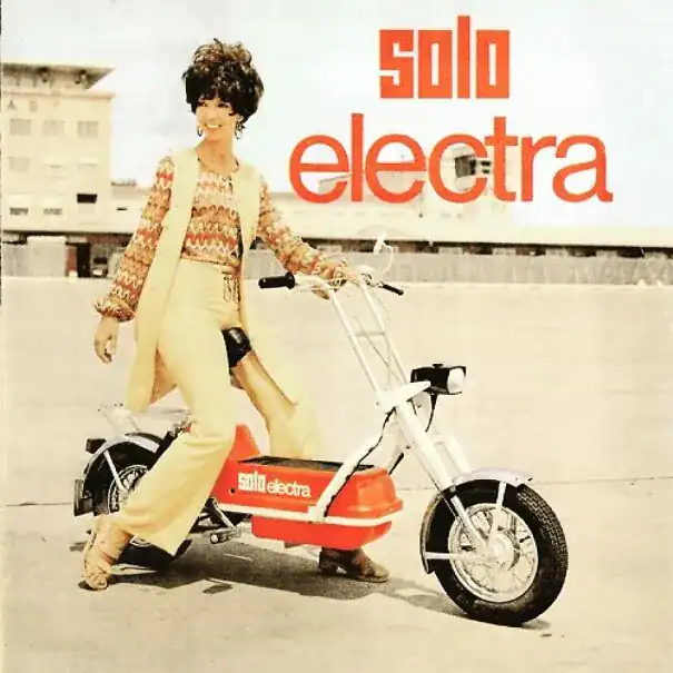 A stylish vintage ad for the Solo Electra scooter featuring a woman in 70s fashion.