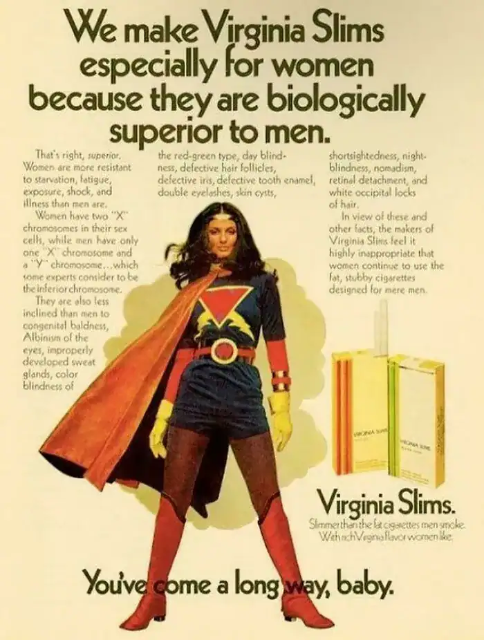 A Virginia Slims cigarette advertisement featuring a woman dressed as a comic book superhero with a cape.