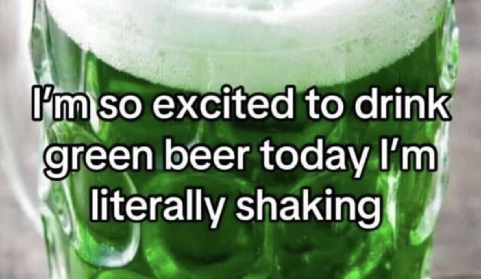 A close-up of a green beer mug with text about being excited for St. Patrick's Day.