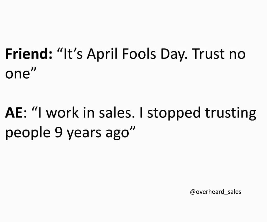 cynical April Fools Day meme regarding corporate culture. It features a dialogue where a friend advises to trust no one because it is April 1st, and a sales professional (AE) replies that working in sales made them stop trusting people nine years ago.