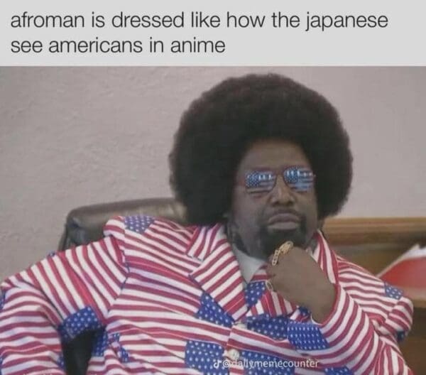 A humorous Afroman trial meme image with text claiming the rapper is "dressed like how the Japanese see Americans in anime". The visual shows Afroman leaning back in court, sporting his vibrant, patriotic suit and flag-tinted eyewear.