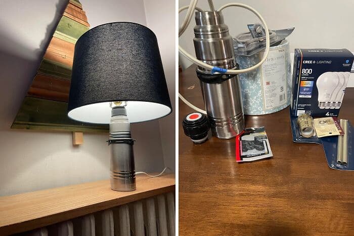 A hilariously bad DIY lamp project showing a standard stainless steel drink thermos horribly wired up to support a glowing lightbulb and a black lampshade.