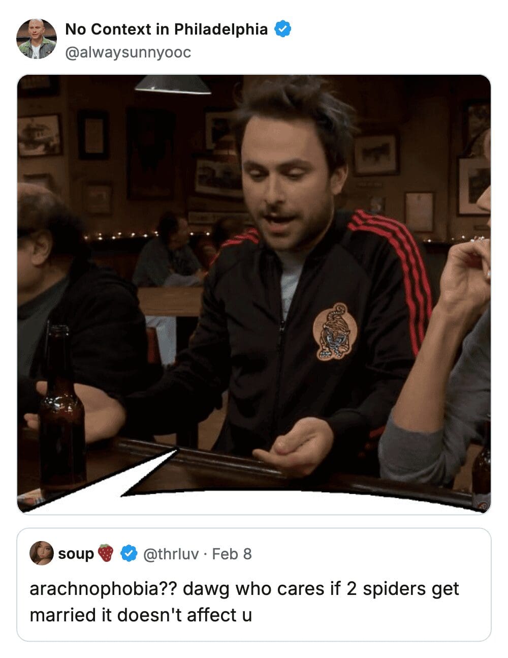 Charlie Kelly in a black track jacket making a point at the bar about spider marriage rights.