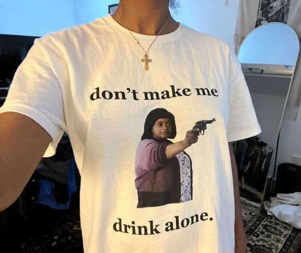 White t-shirt featuring Octavia Spencer from the movie Ma holding a gun with "don’t make me drink alone."