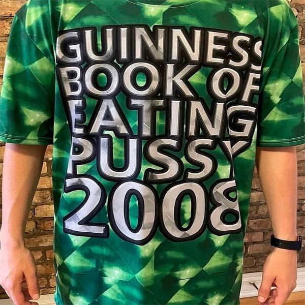 Green patterned t-shirt with large silver text claiming a 2008 Guinness World Record for an explicit act.