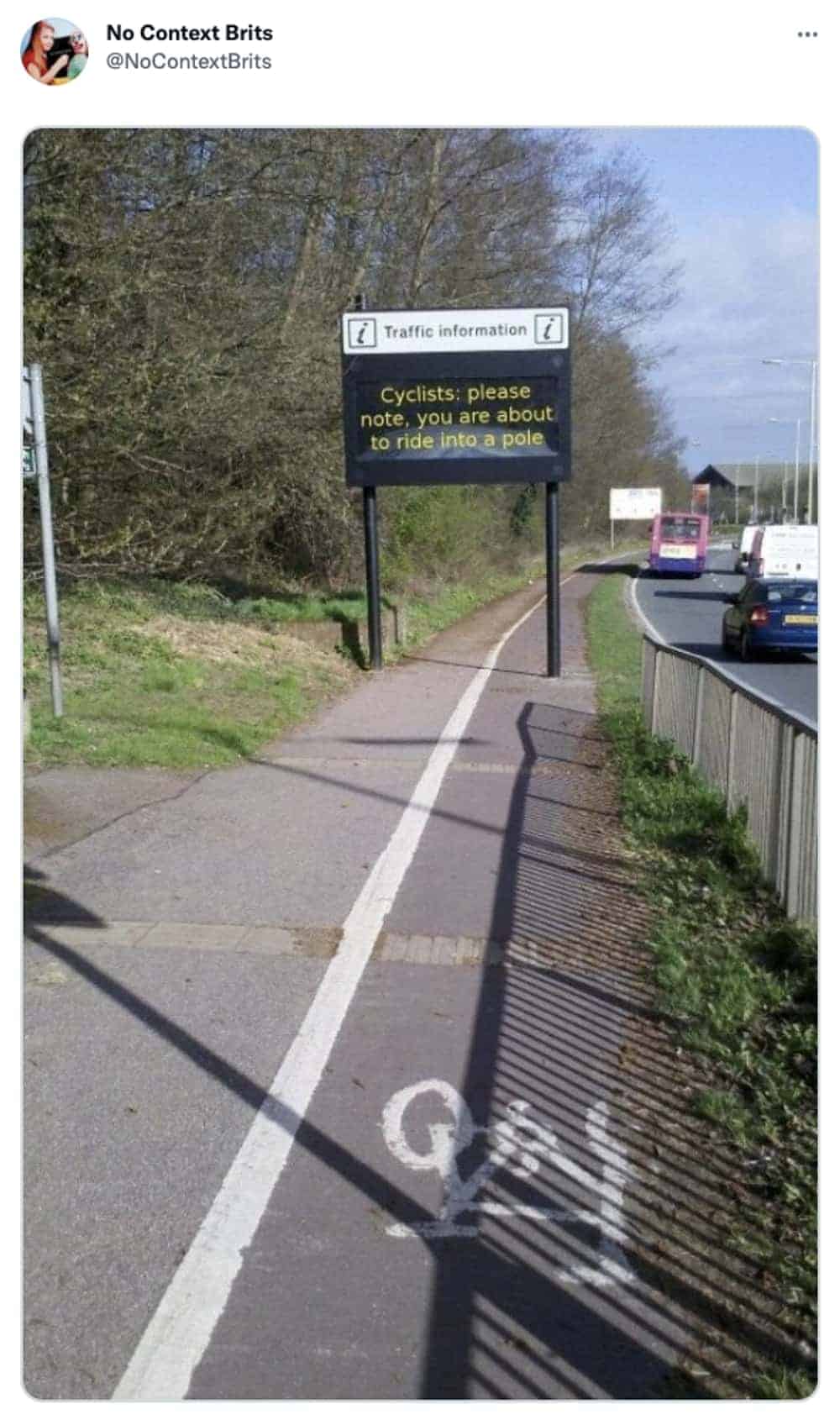 British traffic sign on cycle path warns cyclists about imminent pole collision