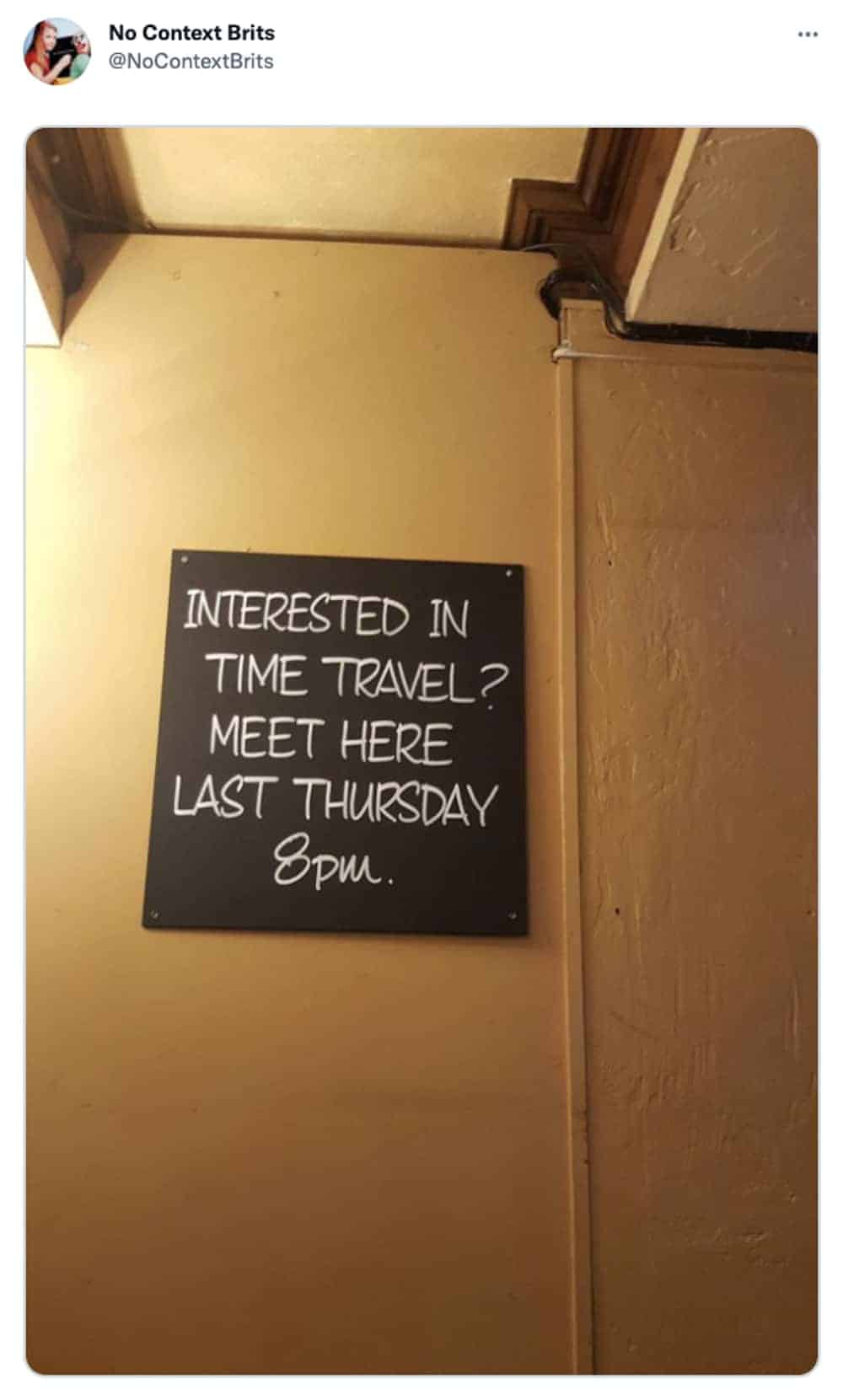Pub chalkboard sign advertises time travel meeting scheduled for last Thursday evening
