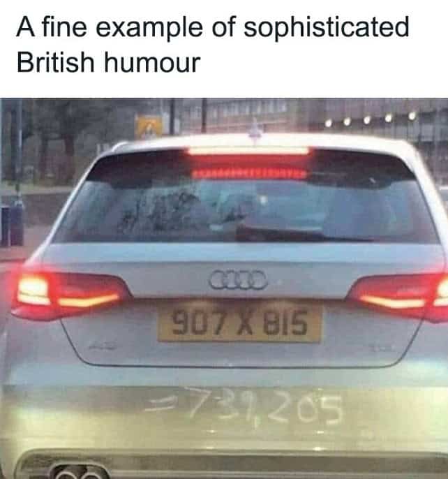 Rear view of an Audi car with a license plate calculation written in the dirt.