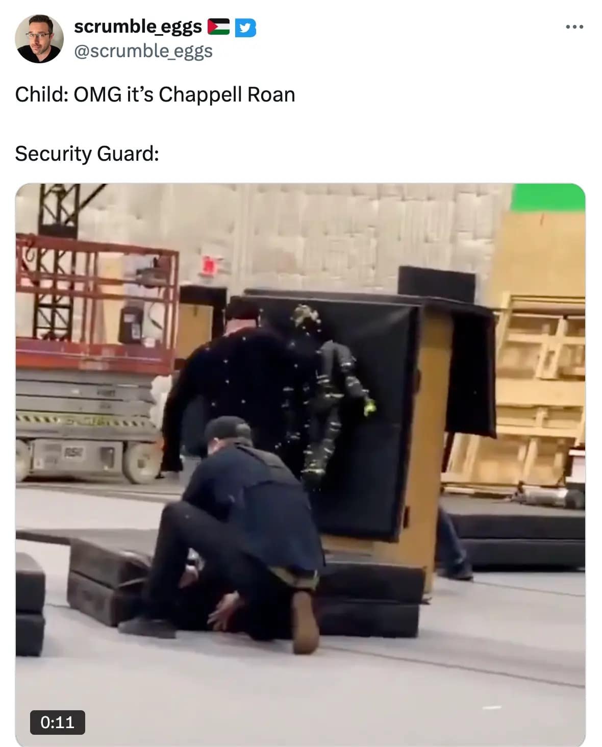 A high-energy Chappell Roan meme poking fun at her security team. The post reads "Child: OMG it’s Chappell Roan. Security Guard:" above a blurry screenshot of a man in black tactical gear performing a violent wrestling tackle on someone.