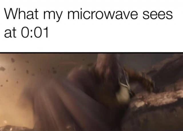 classic meme using a blurry action shot of Thanos lunging forward to represent the sheer panic of desperately opening the microwave at exactly one second left to stop the loud beep, a universally understood entry in old memes.