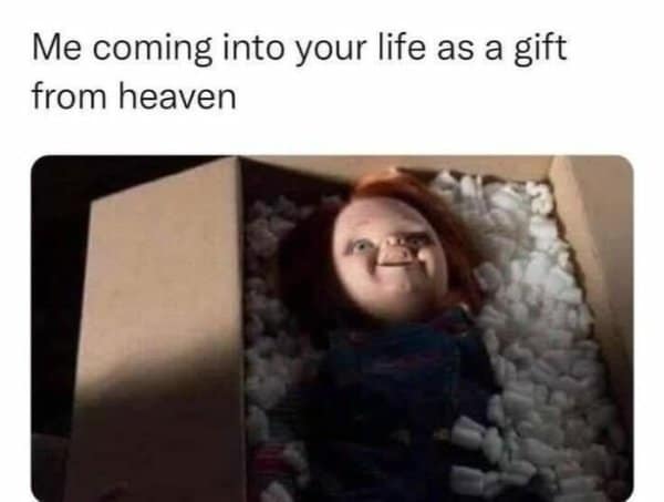 darkly hilarious classic meme featuring the terrifying killer doll Chucky smiling menacingly from inside a shipping box filled with packing peanuts, jokingly labeled as coming into your life as a gift from heaven.
