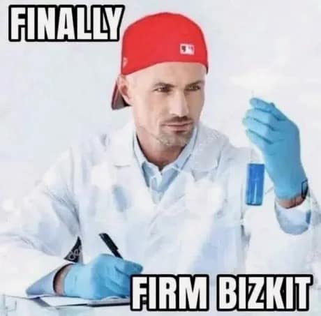 A deeply stupid but brilliant wordplay classic meme showing a stock photo of a scientist in a lab coat holding a glowing blue test tube, triumphantly announcing the discovery of "Firm Bizkit".