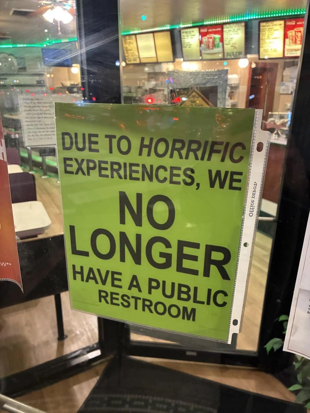 classic meme showing a bright green sign taped to a glass door. The text warns visitors: "DUE TO HORRIFIC EXPERIENCES, WE NO LONGER HAVE A PUBLIC RESTROOM," leaving the specific nature of those experiences to the viewer's imagination.