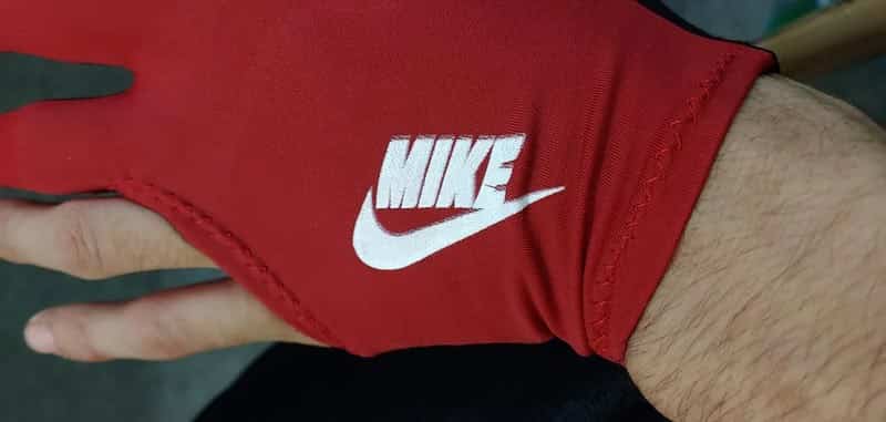 Red glove featuring a white swoosh logo and the name Mike instead of Nike.