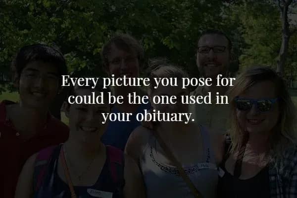A group of smiling friends in a park is obscured by shadows, highlighting a spooky fact reminding viewers that every picture they pose for could be the one eventually used in their obituary.