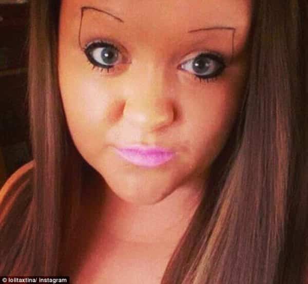 Close up of woman featuring thin rectangular outline eyebrows drawn with a fine dark pencil.