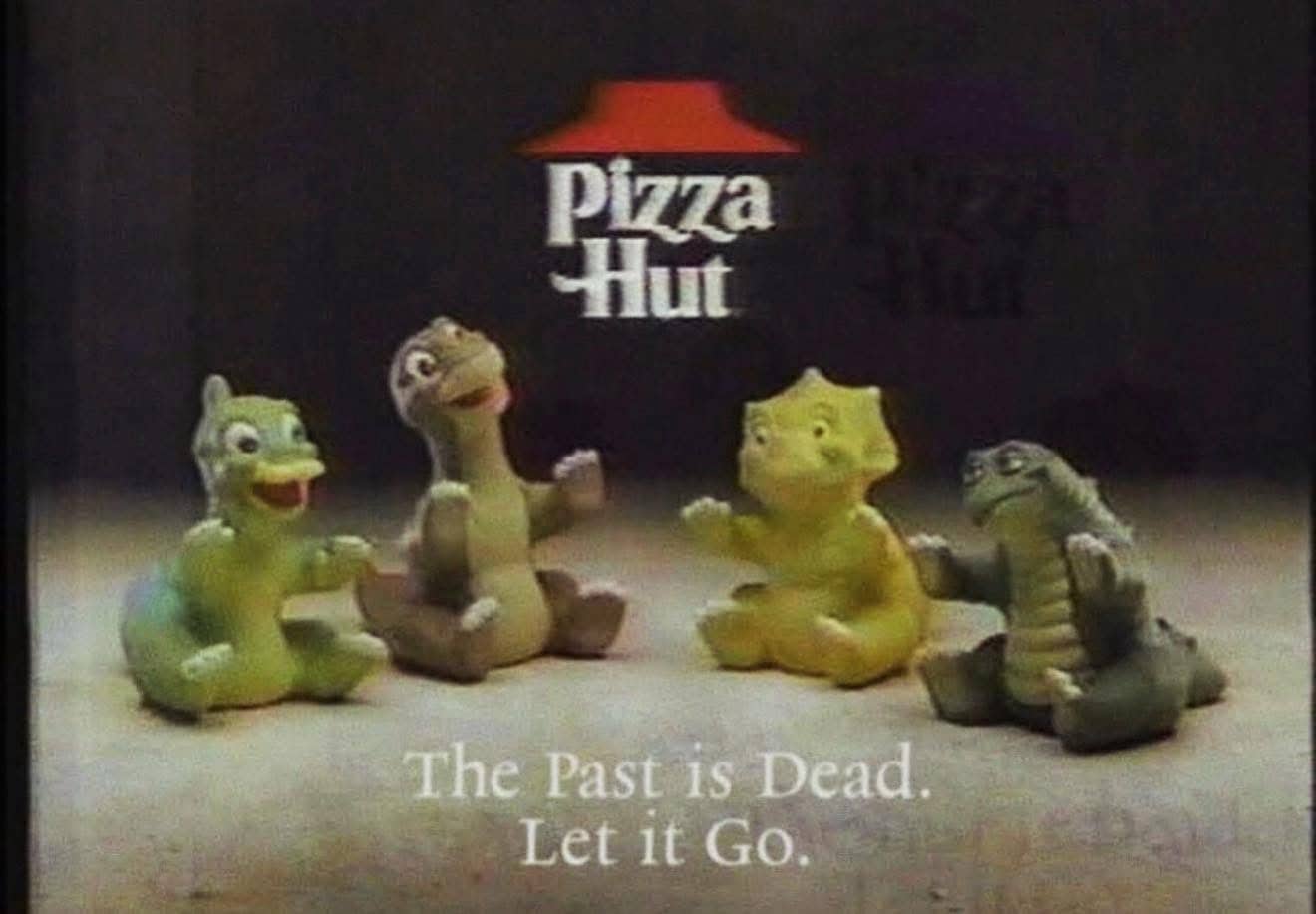 Vintage Pizza Hut advertisement featuring Land Before Time dinosaur toys with an existential nihilist caption.