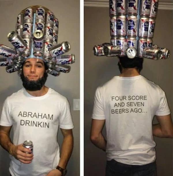 A man wearing a tall top hat made of beer cans labeled Abraham Drinkin.