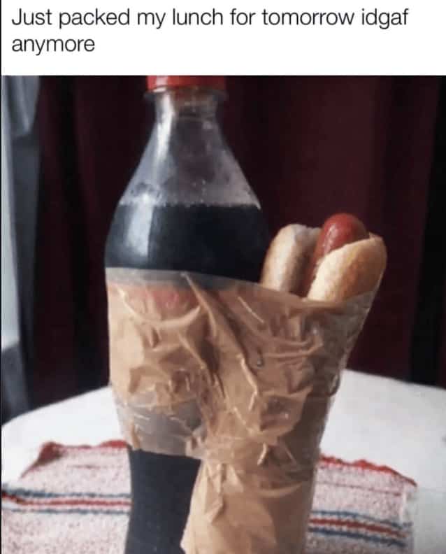 Low-effort lunch preparation showing a hot dog bun and soda bottle taped together.