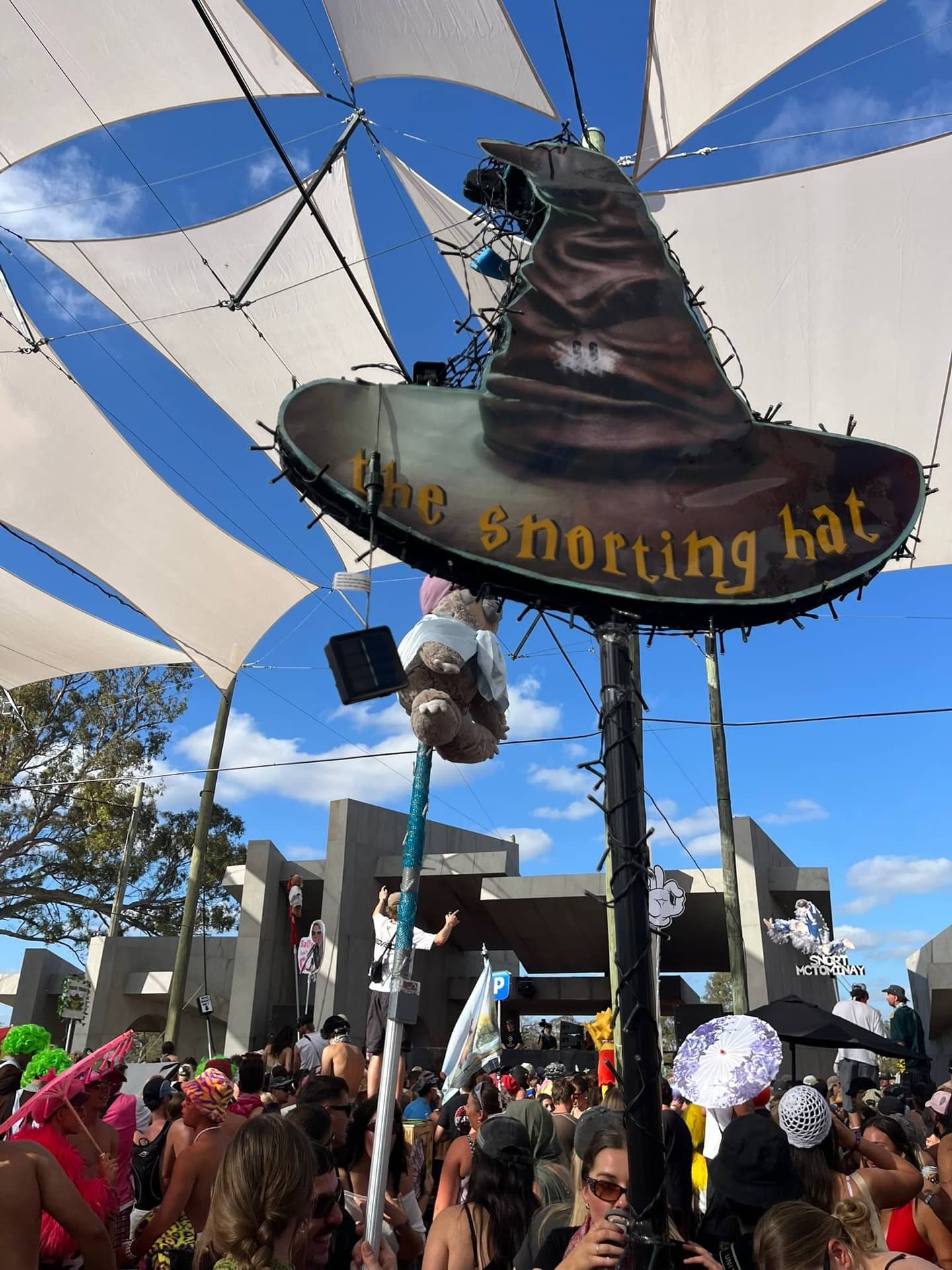 Festival totem pole featuring a parody Harry Potter Sorting Hat renamed the Snorting Hat.