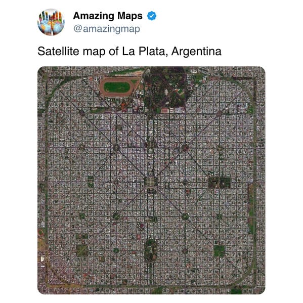 striking satellite view of La Plata, Argentina, showcasing a perfectly symmetrical, rigid square grid pattern with long diagonal avenues and precisely placed green spaces, earning its place as an interesting map.