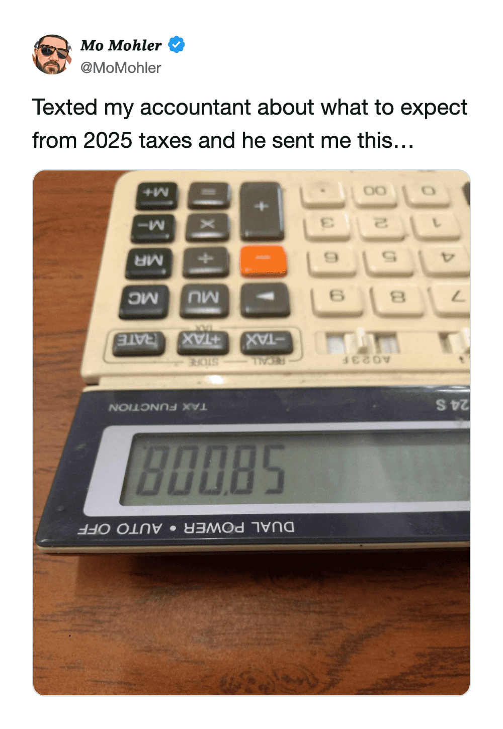 Photo of a calculator showing 80085 as a humorous response from a professional accountant.