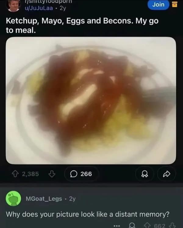 meme dump entry from the r/shittyfoodporn subreddit. A user posts an extremely blurry, hazy photo of eggs and bacon smothered in ketchup and mayo. The top comment by MGoat_Legs perfectly roasts the quality: "Why does your picture look like a distant memory?"