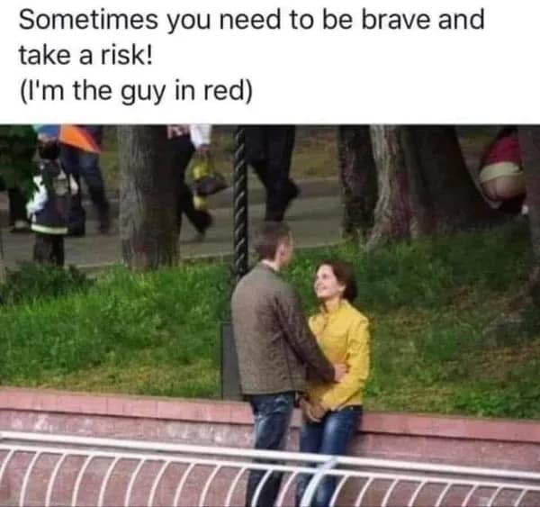 A "look closely" funny meme showing a couple talking in a park, while in the background a man in a red shirt is squatting behind a tree with his pants down, captioned as "being brave and taking a risk."