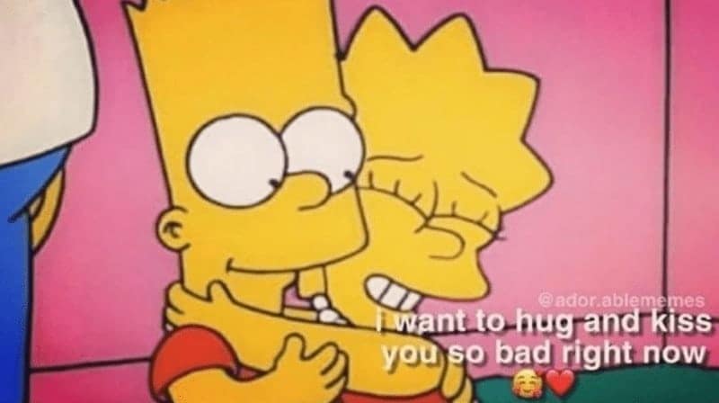 nostalgic relationship meme featuring a grainy, VHS-style still from The Simpsons showing Bart and Lisa Simpson sharing a heartfelt hug. Overlaid text reads, "i want to hug and kiss you so bad right now 🥰❤️," capturing a moment of intense affection.