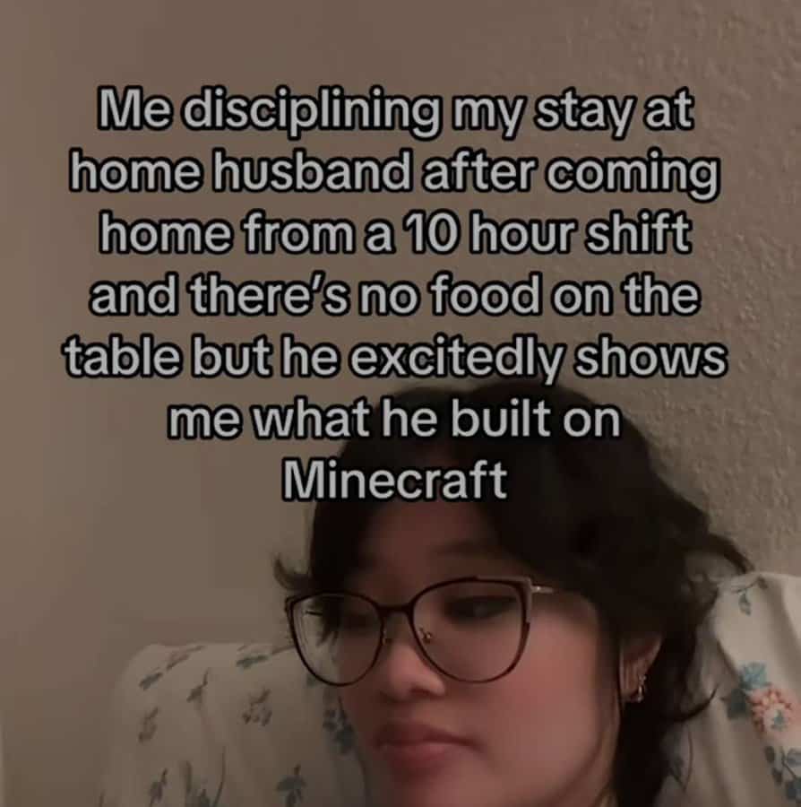 unhinged screenshot featuring a woman with glasses looking exhausted in bed. The text narrates a domestic power struggle: "Me disciplining my stay at home husband after coming home from a 10 hour shift and there’s no food on the table but he excitedly shows me what he built on Minecraft."