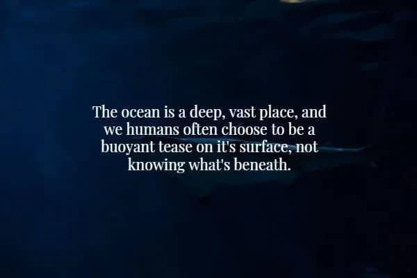 Dark blue ocean water with text describing humans as buoyant teases on the surface of the deep.